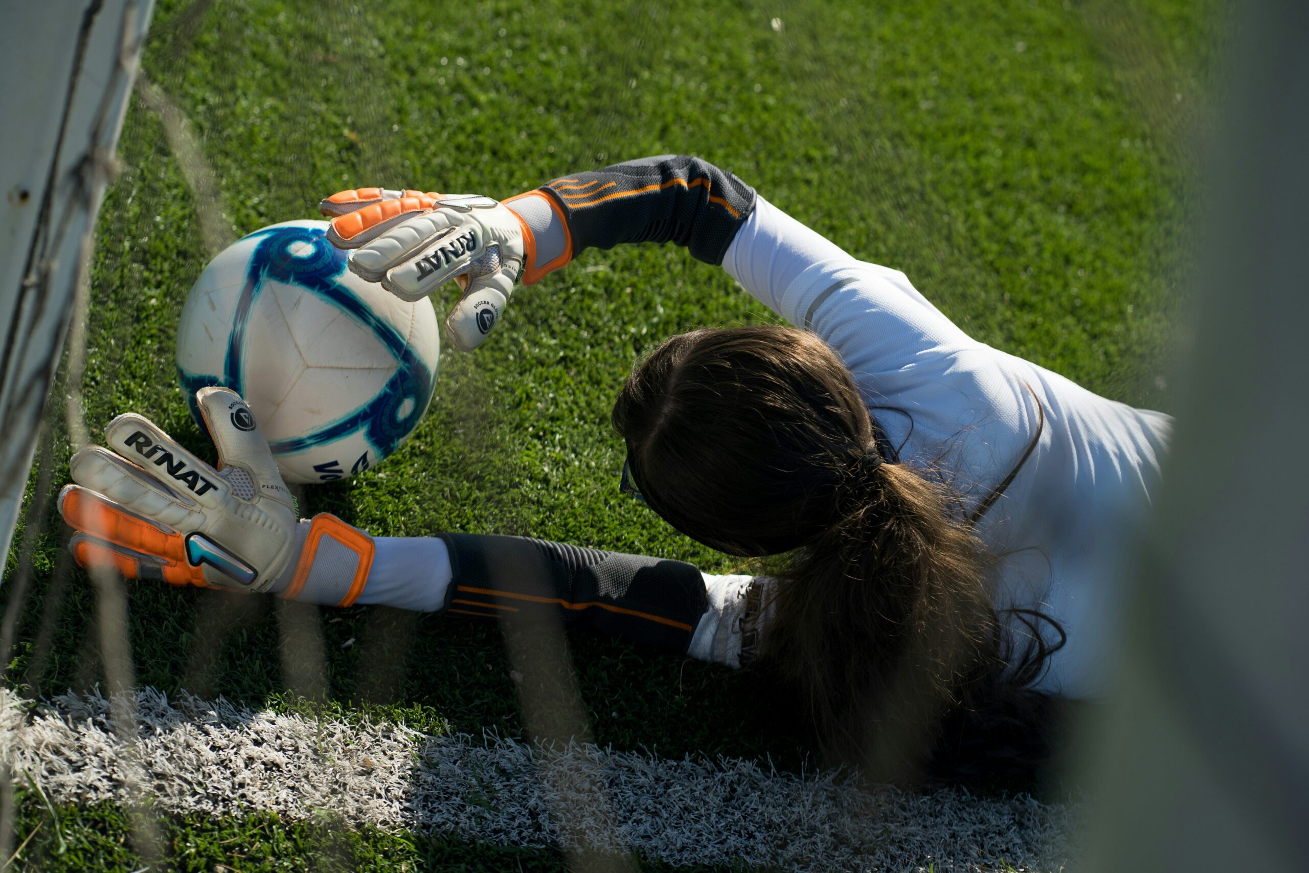 Girls running soccer drills in crisp fall weather